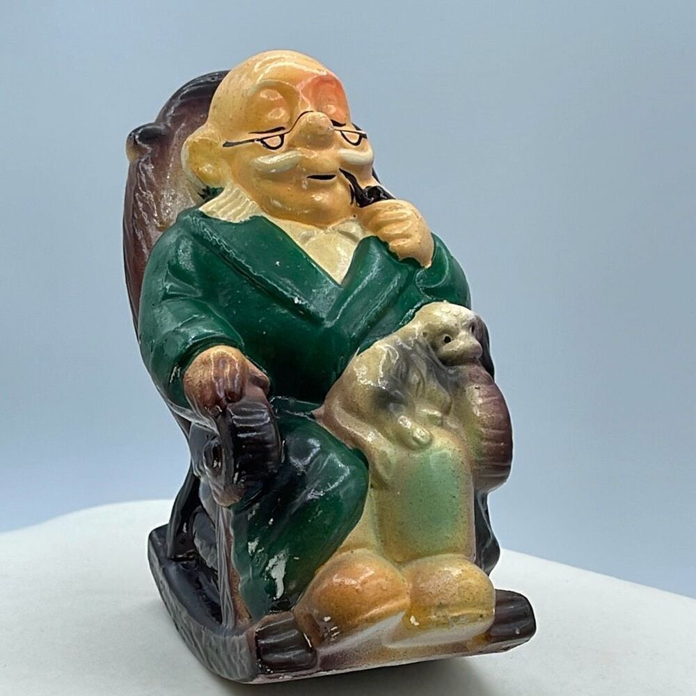 Vintage ceramic grandpa in rocking chair bank.